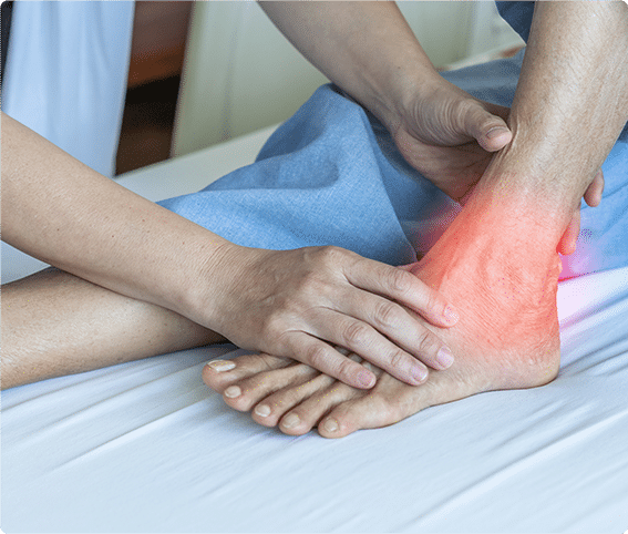 doctor treating a patient with red highlighted ankle