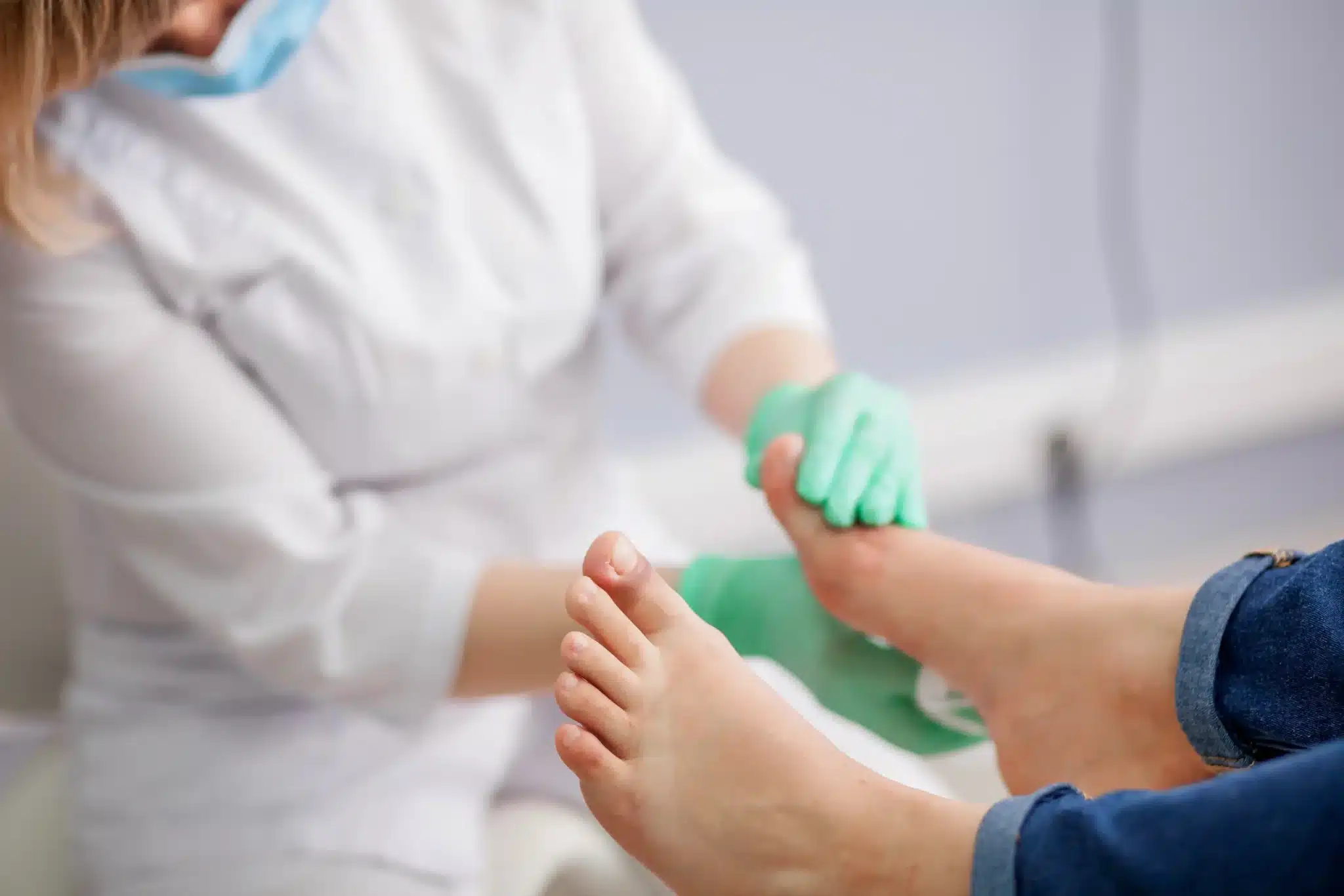 Podiatrist examining patient heel pain and plantar fasciitis at Victoria Foot and Ankle Center