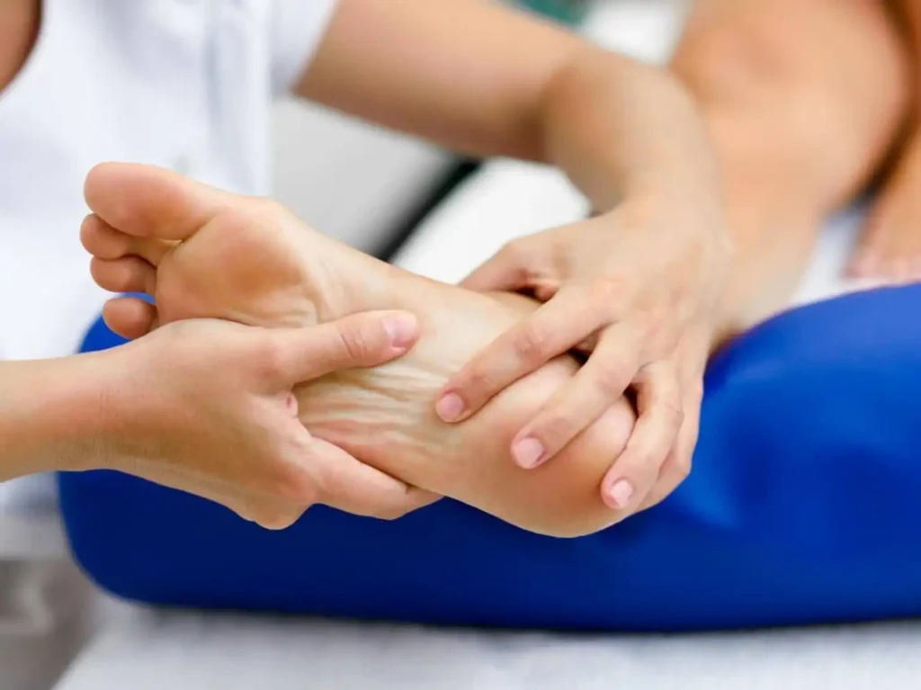 Clinician assessing stability in a patient's foot and ankle